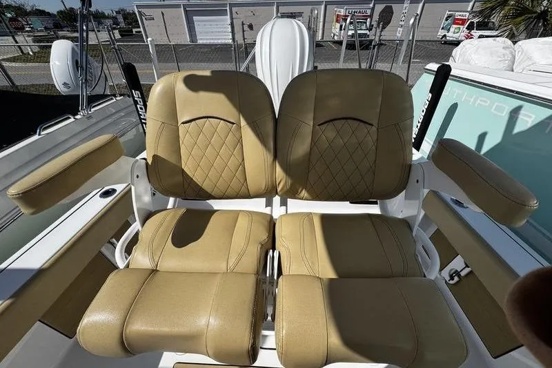 Slide: The Image of 2026 Sportsman Masters 247 Bay Boat with tan leather seats and armrests. - 19
