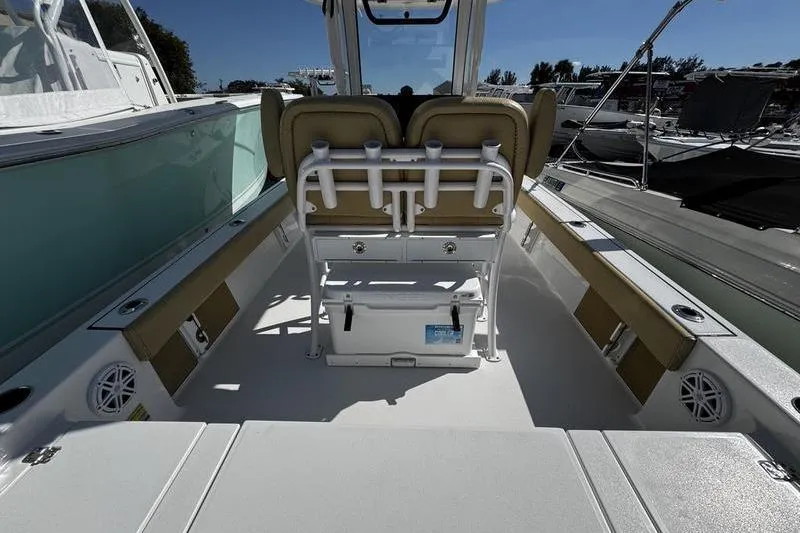 Slide: The Image of 2026 Sportsman Masters 247 Bay Boat interior with seating and storage features. - 21