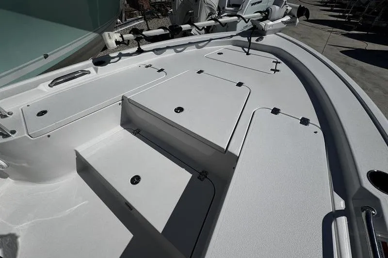 Slide: The Image of 2026 Sportsman Masters 247 Bay Boat deck with storage compartments and sleek design. - 3