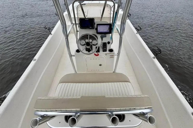 Slide: The Image of 2017 Carolina Skiff 238 DLV boat interior with steering console and seating. - 6