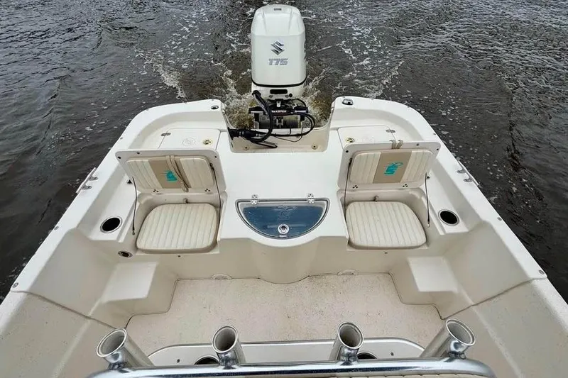 Slide: The Image of 2017 Carolina Skiff 238 DLV boat with Suzuki 175 engine on water. - 8