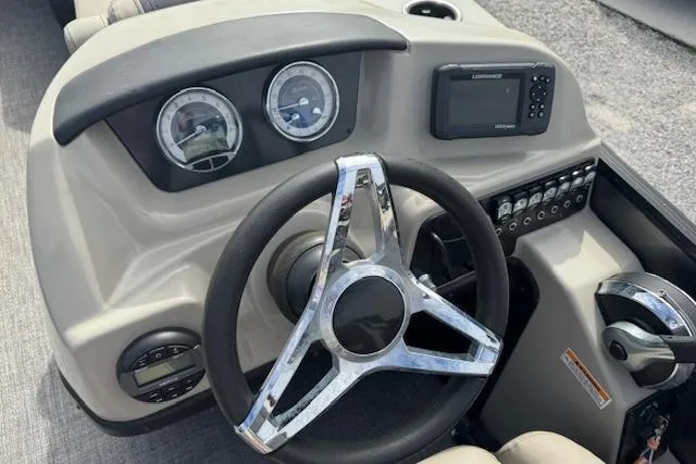 Slide: The Image of 2022 Barletta Cabrio 22UC dashboard with steering wheel, gauges, and control panel. - 17