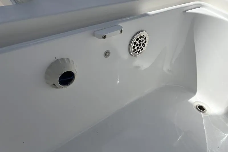 Slide: The Image of Interior detail of 2022 Islamorada 24 Morada boat, featuring drainage and ventilation components. - 11
