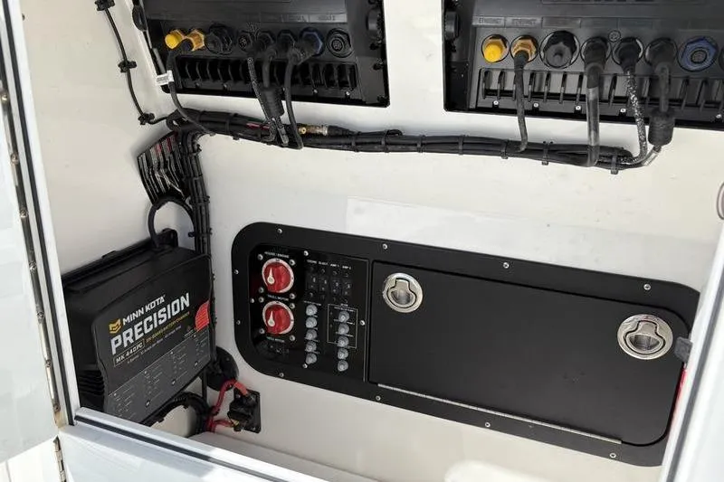 Slide: The Image of Electrical panel of 2022 Islamorada 24 Morada boat with Minn Kota Precision charger. - 14