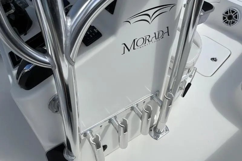 Slide: The Image of Close-up of 2022 Islamorada 24 Morada boat console with chrome details. - 15