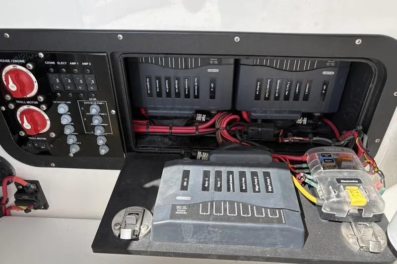 Slide: The Image of Electrical panel of 2022 Islamorada 24 Morada boat with switches and wiring. - 16