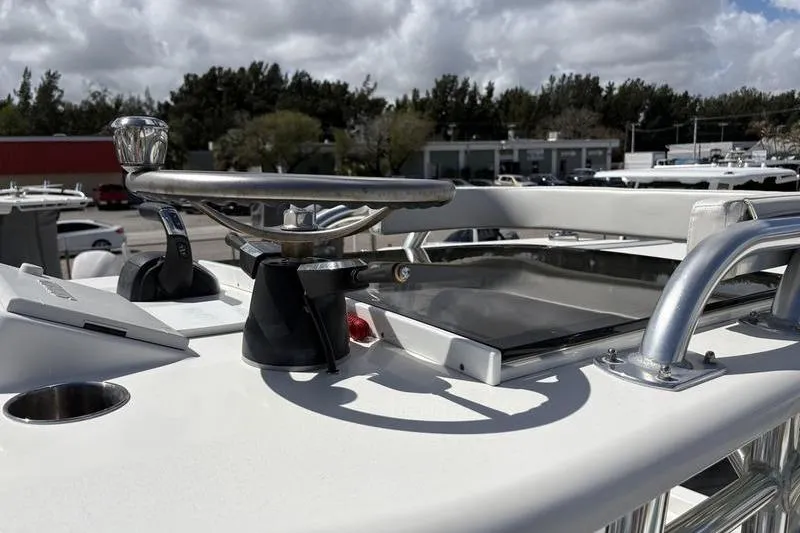 Slide: The Image of 2022 Islamorada 24 Morada boat helm with steering wheel and controls. - 19
