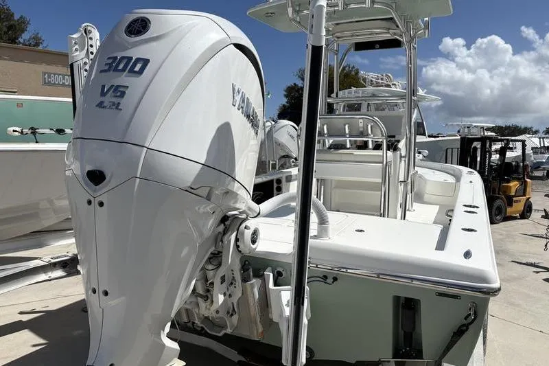 Slide: The Image of 2022 Islamorada 24 Morada boat with Yamaha 300 V6 engine, docked outdoors. - 25
