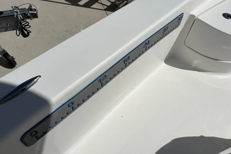 Slide: The Image of 2022 Islamorada 24 Morada boat with built-in measuring ruler on deck. - 4