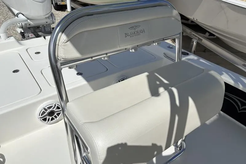 Slide: The Image of 2022 Islamorada 24 Morada boat seat with stainless steel frame and white upholstery. - 5