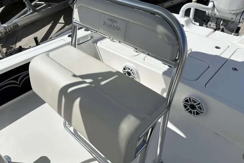 Slide: The Image of 2022 Islamorada 24 Morada boat seat with stainless steel frame and white upholstery. - 8