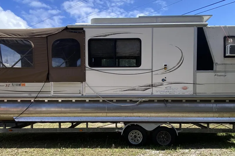The Image of 2006 Sun Tracker Party Cruiser 32 Regency Edition pontoon boat on trailer. - 1