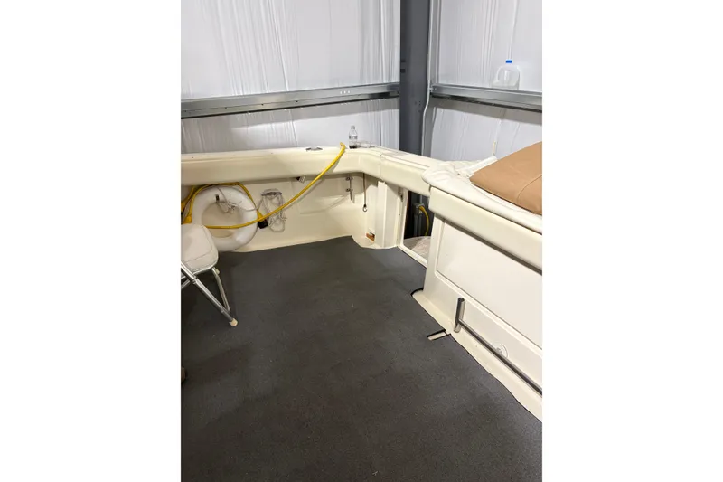 Slide: The Image of 1994 Tiara Yachts 3100 Open interior seating with beige upholstery. - 10