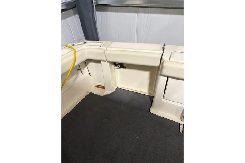 Slide: The Image of 1994 Tiara Yachts 3100 Open interior with seating and carpeted floor. - 11