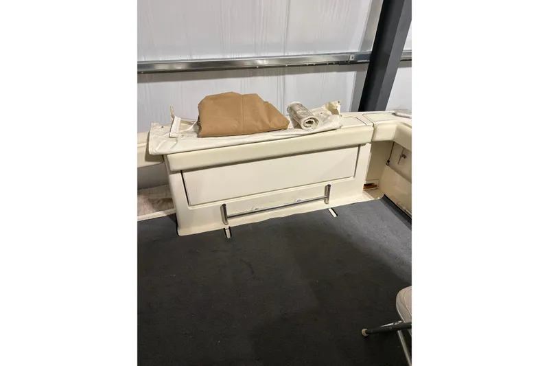 Slide: The Image of 1994 Tiara Yachts 3100 Open interior with seating and storage, featuring a clean, organized layout. - 14