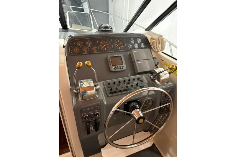 Slide: The Image of 1994 Tiara Yachts 3100 Open interior with folded canvas and storage area. - 17