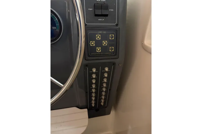 Slide: The Image of Interior view of 1994 Tiara Yachts 3100 Open, showcasing helm and window details. - 19