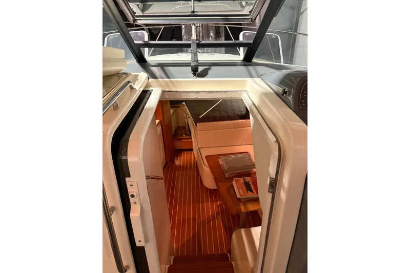 Slide: The Image of 1994 Tiara Yachts 3100 Open dashboard with steering wheel and gauge. - 24