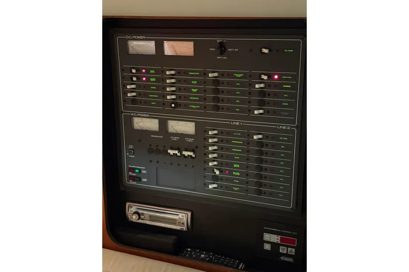 Slide: The Image of 1994 Tiara Yachts 3100 Open helm with steering wheel and control panel. - 25