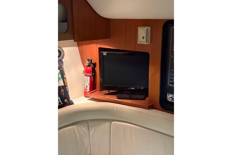 Slide: The Image of 1994 Tiara Yachts 3100 Open interior with wood flooring and seating area. - 26