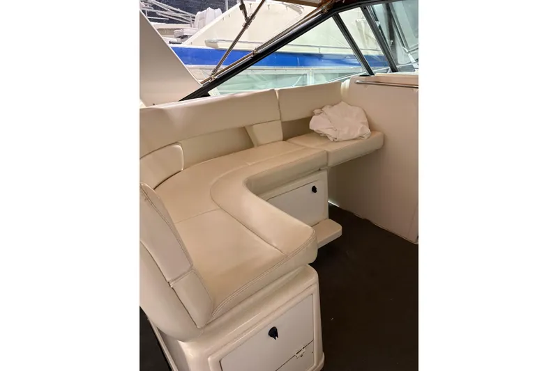 Slide: The Image of 1994 Tiara Yachts 3100 Open on a boat lift, ready for maintenance. - 3