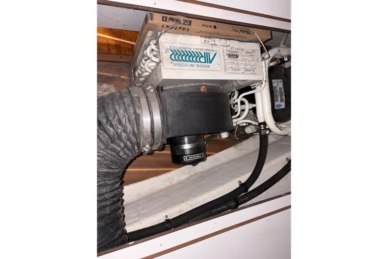 Slide: The Image of Microwave in 1994 Tiara Yachts 3100 Open, with blue checkered cloth nearby. - 40