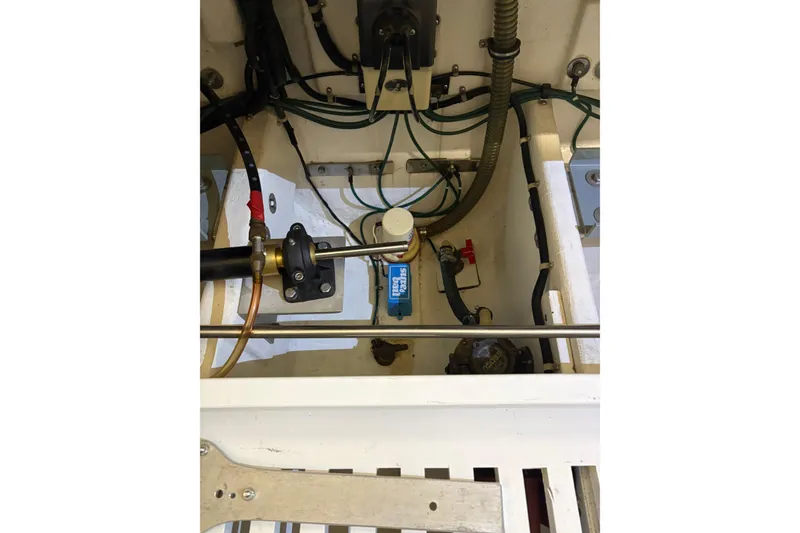 Slide: The Image of Engine compartment of a 1994 Tiara Yachts 3100 Open, showcasing mechanical components. - 47