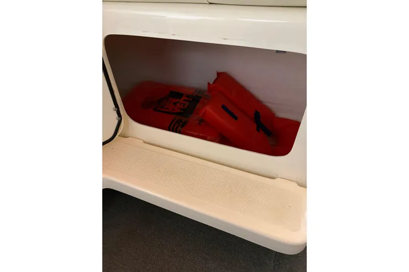 Slide: The Image of Coiled cables in a 1994 Tiara Yachts 3100 Open boat compartment. - 53