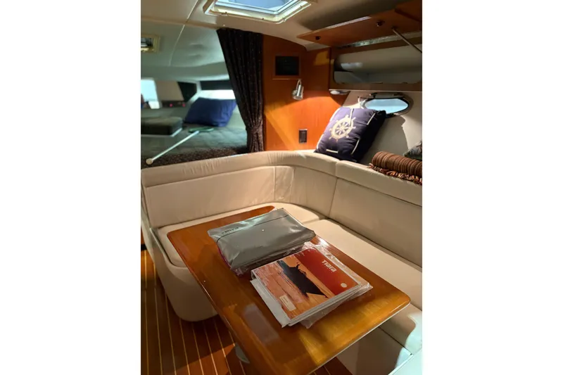 Slide: The Image of 1994 Tiara Yachts 3100 Open interior detail with storage compartment and ladder. - 54