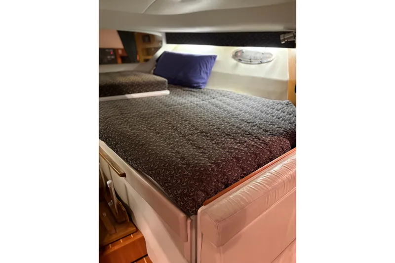 Slide: The Image of Storage compartment with red life jackets on a 1994 Tiara Yachts 3100 Open. - 56