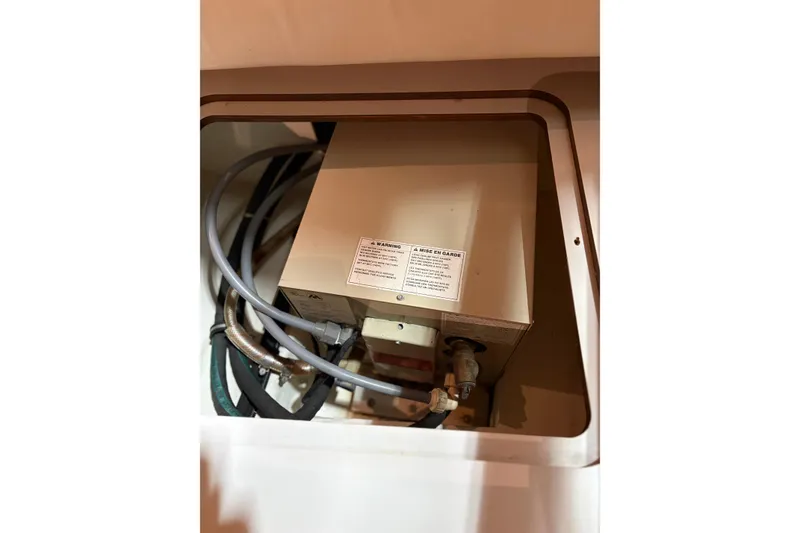 Slide: The Image of Storage compartment with life jackets on a 1994 Tiara Yachts 3100 Open. - 57