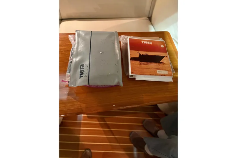 Slide: The Image of Interior of 1994 Tiara Yachts 3100 Open with cozy seating and nautical decor. - 58