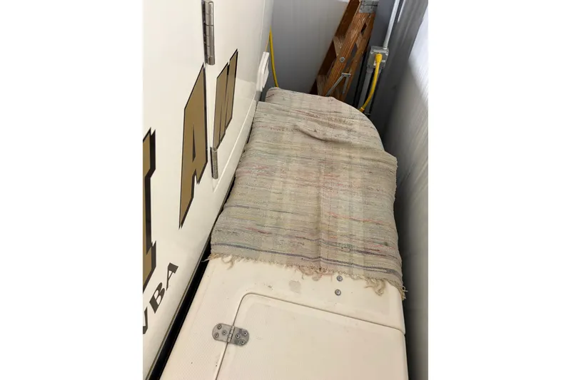 Slide: The Image of 1994 Tiara Yachts 3100 Open with covered deck, stored indoors. - 69