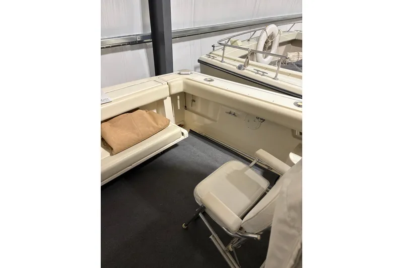 Slide: The Image of 1994 Tiara Yachts 3100 Open in storage, showcasing sleek design and spacious deck. - 8