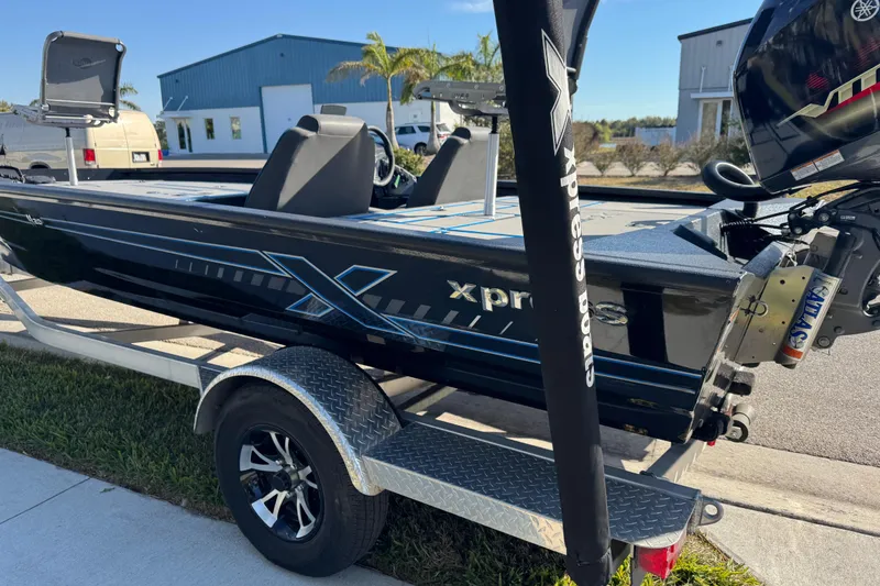 Slide: The Image of 2025 Express H20 boat on trailer, featuring sleek design and Yamaha motor. - 11
