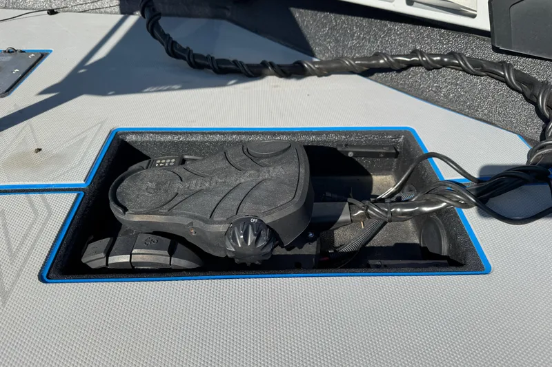 Slide: The Image of Foot pedal control on Express H20 boat, 2025 model, with wiring and textured surface. - 17
