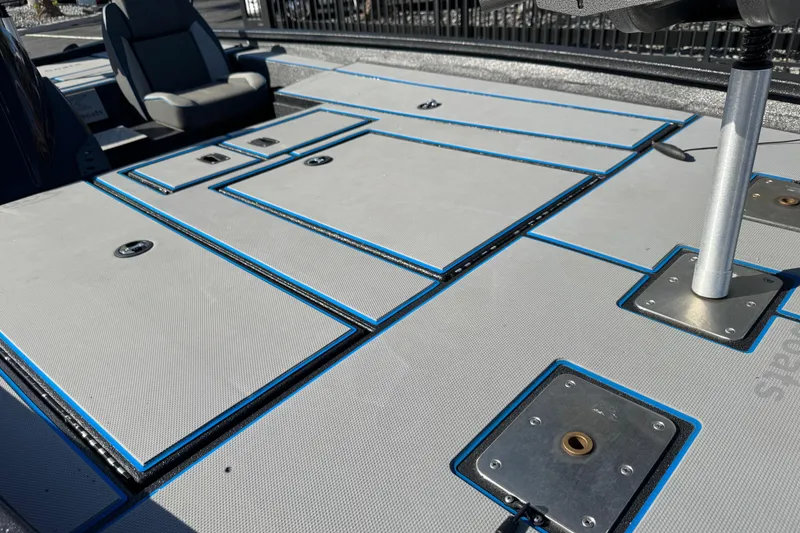 Slide: The Image of 2025 Express H20 boat deck with storage compartments and seating. - 18