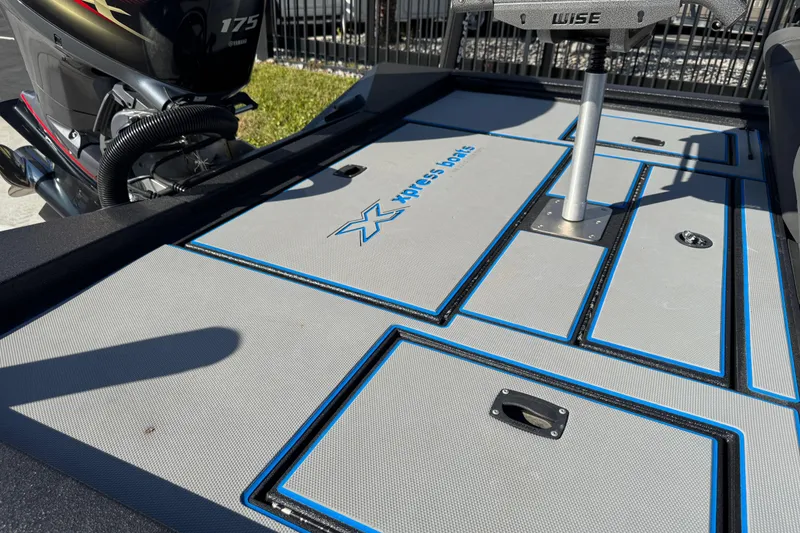 Slide: The Image of Deck of 2025 Express H20 boat with Yamaha 175 engine, featuring storage compartments. - 22