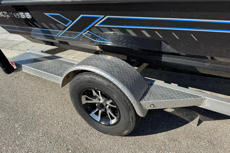 Slide: The Image of Express H20 2025 boat trailer with diamond plate fender and black alloy wheel. - 24