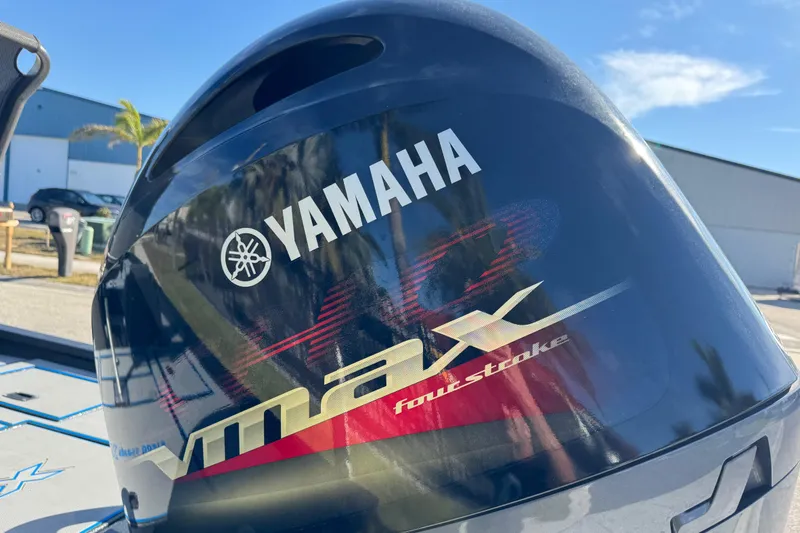 Slide: The Image of Yamaha VMAX four-stroke engine on Express H20, 2025 model, in sunny outdoor setting. - 8