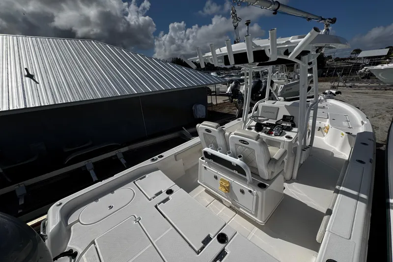 Slide: The Image of 2021 Blue Wave 2600 PureBay boat with dual seats and advanced navigation system. - 7