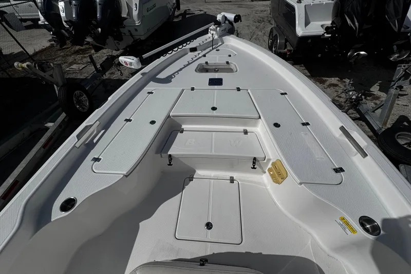 Slide: The Image of 2021 Blue Wave 2600 PureBay boat deck with storage compartments and clean design. - 8