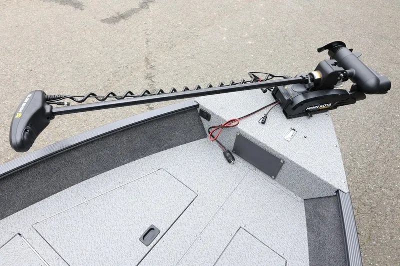 Slide: The Image of 2026 Lund 1650 Angler SS boat with Minn Kota trolling motor on deck. - 14