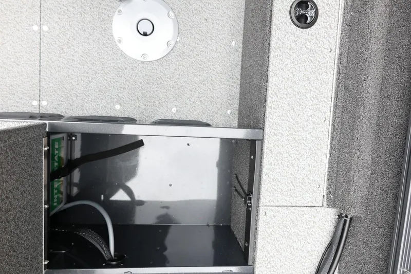 Slide: The Image of Interior view of 2026 Lund 1650 Angler SS boat storage compartment. - 25