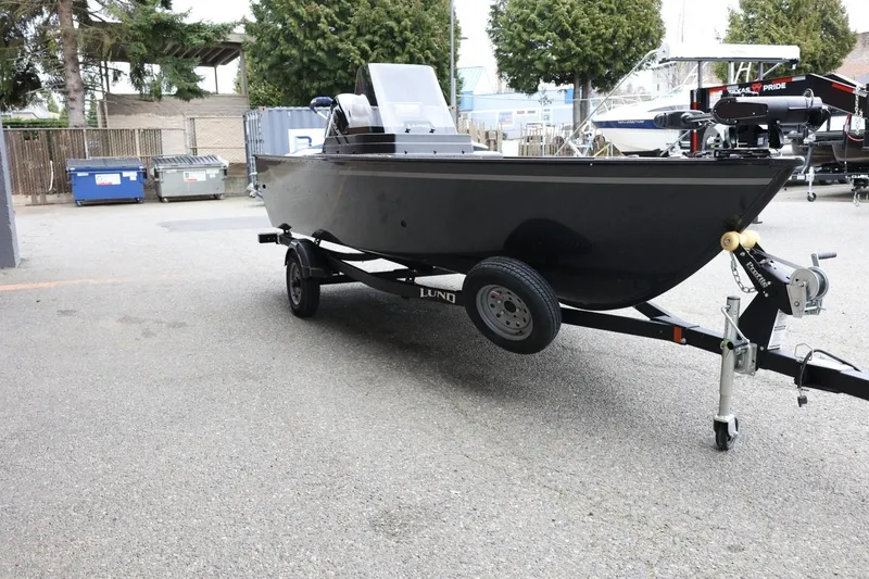 Slide: The Image of 2026 Lund 1650 Angler SS boat on trailer in outdoor setting. - 4