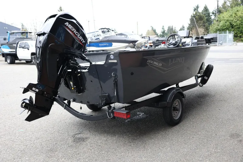 Slide: The Image of 2026 Lund 1650 Angler SS boat on trailer with Mercury outboard motor. - 6