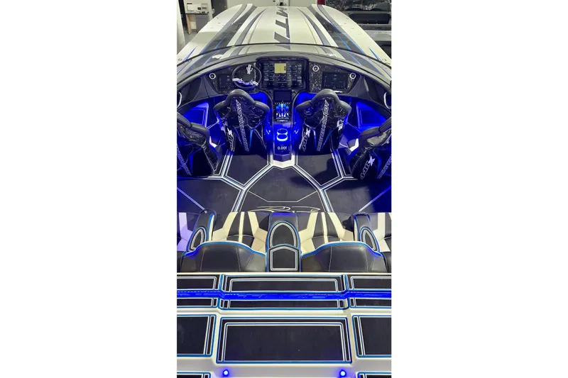 Slide: The Image of Interior of 2025 MTI 440 boat with illuminated blue accents and modern seating. - 13
