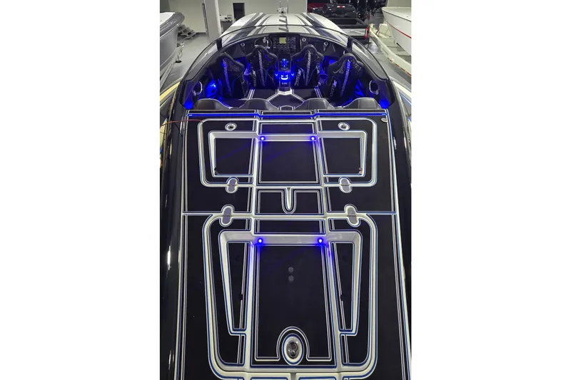 Slide: The Image of 2025 MTI 440 boat with illuminated deck design and blue LED lights. - 14