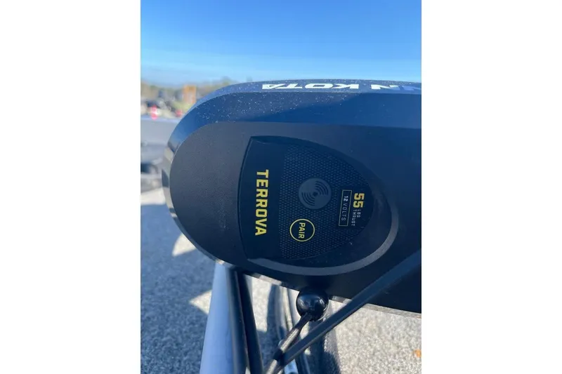 Slide: The Image of Close-up of Terrova motor on 2024 CustomBilt Pondtoon 1672 under clear blue sky. - 6