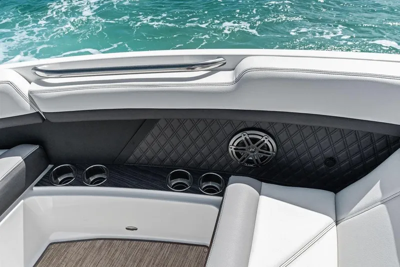 Slide: The Image of Interior of 2022 Cobalt R8 Outboard boat with cup holders and speaker. - 17